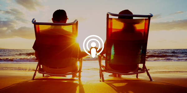 couple sitting on beach after retiring